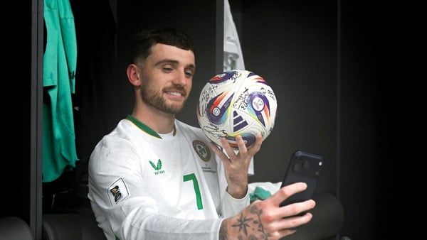 Troy Parrott with the match ball after his hat-trick in Budapest
