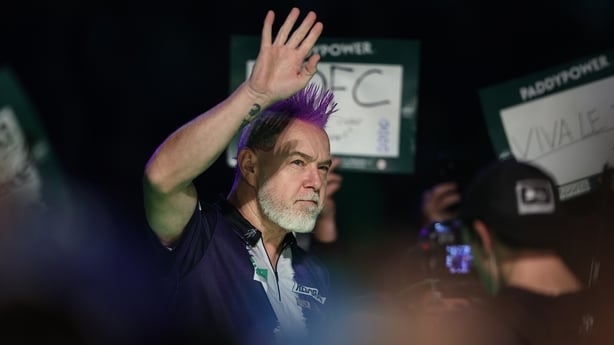 LONDON, ENGLAND - DECEMBER 23: Peter Wright of Scotland acknowledges the crowd as he makes his entrance prior to his Round 2 match against Arno Merk of Germany in the Paddy Power World Darts Championship at Alexandra Palace on December 23, 2025 in London, England. (Photo by James Fearn/Getty Images)