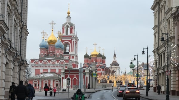 MOSCOW, RUSSIA - DECEMBER 23: MOSCOW, RUSSIA A food delivery courier rides an electric scooter down the Varvarka street in freezing, snowless weather, on December 23, 2025 in Moscow, Russia. (Photo by Contributor/Getty Images)