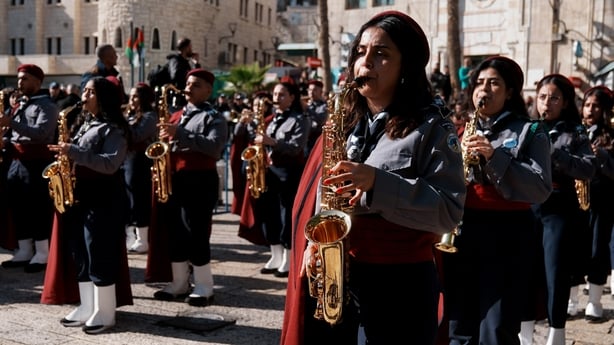 Marching band performs in a parade as Christians from around the world visit the Church of the Nativity, believed to mark the birthplace of Jesus