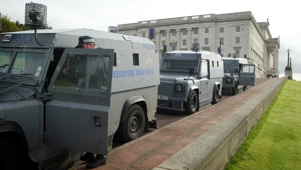 Police prepare to leave Stormont after a raid on the Sinn Fein office. A former messenger who once worked at the Government's main offices in Belfast has been arrested as part of a major police investigation into IRA intelligence gathering. * The man was