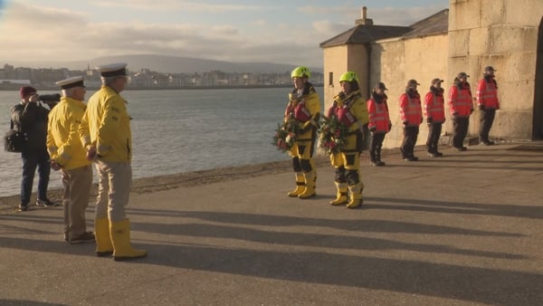 Members of the RNLI lay wreaths