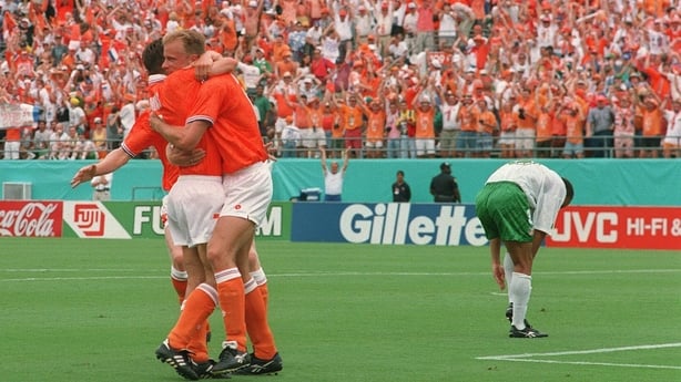 4 July 1994; Holland's Denis Bergkamp is congratulated by team-mate Marc Overmars on scoring their sides goal as Terry Phelan, (3) Republic of Ireland, looks on. FIFA World Cup Finals, Repiblic of Ireland v Holland, Orange Bowl, Orlando, Florida, USA. Picture credit; David Maher / SPORTSFILE