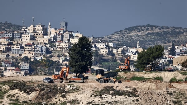This picture shows earthmovers next to the deserted mosque in the settlement of Sa-Nur, south of Jenin, in the occupied West Bank on December 24, 2025. An Israeli minister announced on August 7 plans to rebuild Sa-Nur, a settlement in the occupied West Ba