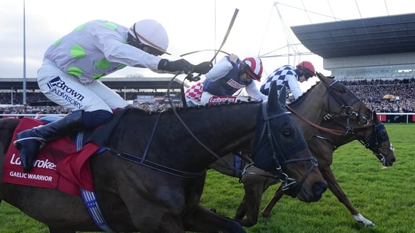 SUNBURY, ENGLAND - DECEMBER 26: Ben Jones riding The Jukebox Man (red/white striped cap) clear the last to win The Ladbrokes King George VI Chaseat Kempton Park Racecourse on December 26, 2025 in Sunbury, England. (Photo by Alan Crowhurst/Getty Images)