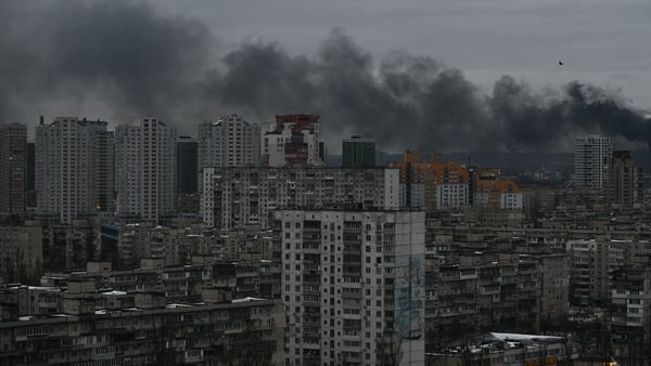 smoke rising above residential buildings following Russian drones and missiles attack, in Kyiv