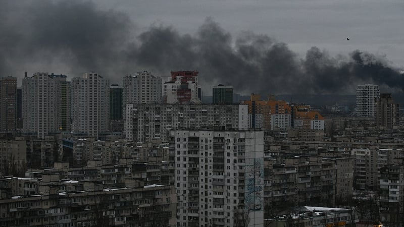 Smoke rises above residential buildings in Kyiv