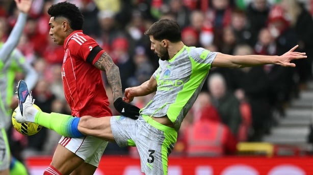 Manchester City's Portuguese defender #03 Ruben Dias (R) vies with Nottingham Forest's Brazilian striker #19 Igor Jesus (C) during the English Premier League football match between Nottingham Forest and Manchester City at The City Ground in Nottingham, central England, on December 27, 2025. 