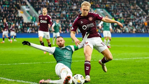 EDINBURGH, SCOTLAND - DECEMBER 27: Hibernian's Martin Boyle (L) and Hearts' Harry Mline in action during a William Hill Premiership match between Hibernian and Heart of Midlothian at Easter Road, on December 27, 2025, in Edinburgh, Scotland. (Photo by Roddy Scott/SNS Group via Getty Images)