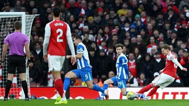 Martin Odegaard of Arsenal scores his team's first goal during the Premier League match between Arsenal and Brighton & Hove Albion at the Emirates Stadium on December 27, 2025 in London, England. 