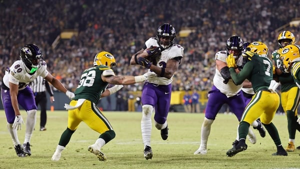 GREEN BAY, WISCONSIN - DECEMBER 27: Derrick Henry #22 of the Baltimore Ravens runs with the ball in the second quarter against the Green Bay Packers at Lambeau Field on December 27, 2025 in Green Bay, Wisconsin. (Photo by Michael Reaves/Getty Images)
