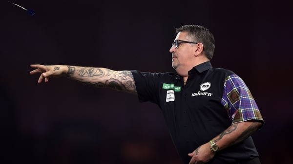 LONDON, ENGLAND - DECEMBER 28: Gary Anderson of Scotland throws against Jermaine Wattimena of the Netherlands (Not Pictured) during their Third Round match at Alexandra Palace on December 28, 2025 in London, England. (Photo by James Fearn/Getty Images)