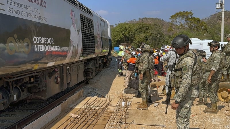 Mexican Army soldiers and Civil Protection members rescue passengers from the Interoceanic train that derailed in Nizanda, Oaxaca state
