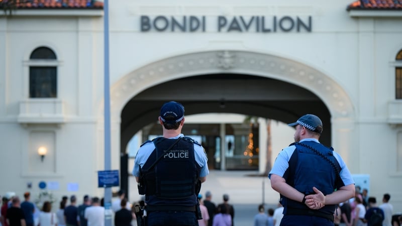 Police stand guard at the entrance to the pavilion at Bondi Beach in Sydney