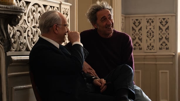 (L-R) Actor Toni Servillo and director Paolo Sorrentino share a laugh on the set of La Grazia