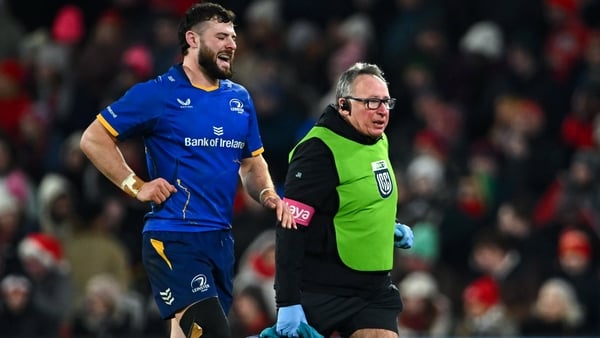 Robbie Henshaw leaves the pitch at Thomond Park to recieve medical attention