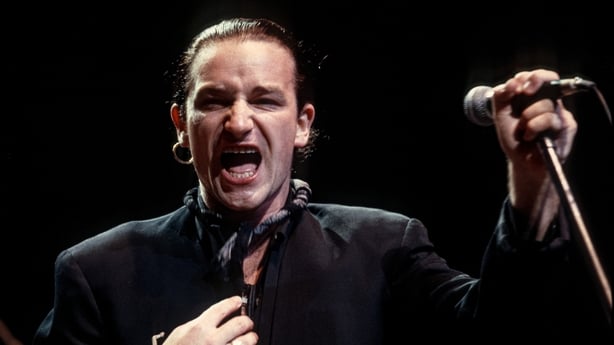 Singer Bono (Paul David Hewson) of the Irish rock band U2 performs in support of the bands Joshua Tree Tour on May 13, 1987 at the Brendan Byrne Arena in East Rutherford, New Jersey. (Photo By Larry Busacca/Getty Images)