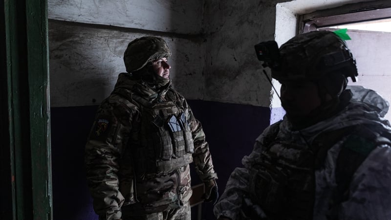 A Ukrainian soldier takes shelter from drones in Kostiantynivka, Ukraine