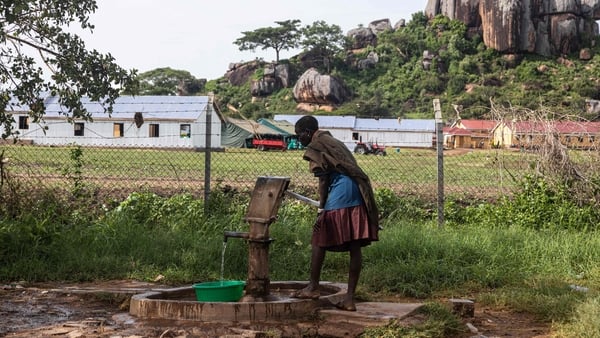 A woman fetches water at a borehole in Kaabong, Karamoja region, Uganda