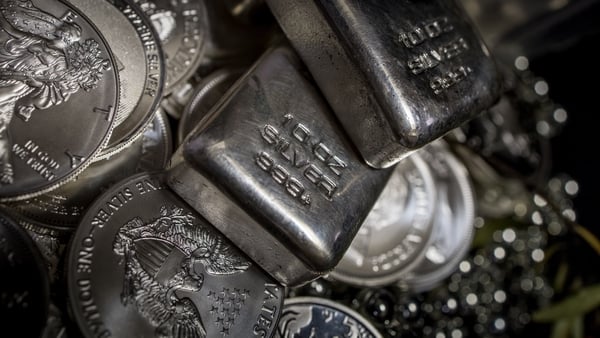 A pile of Silver bullion bars and coins