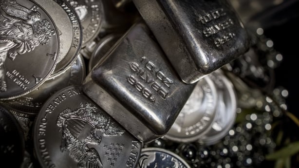 A pile of Silver bullion bars and coins