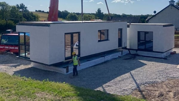 Image of a modular house being constructed on a site