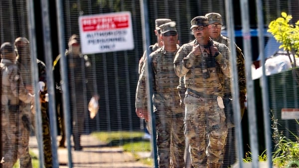Texas National Guard members patrol outside of the US Immigration and Customs Enforcement holding facility in Broadview