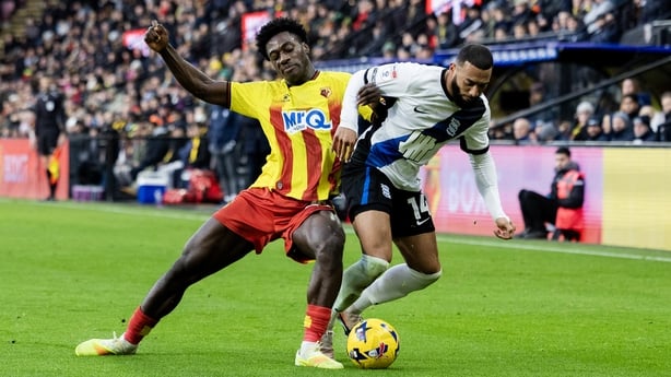 James Abankwah of Watford tackles Keshi Anderson of Birmingham City during the Sky Bet Championship match between Watford and Birmingham City at Vicarage Road on January 1, 2026 in Watford, England.