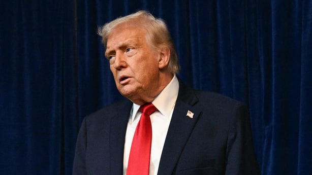 Donald Trump looks ahead during a press conference