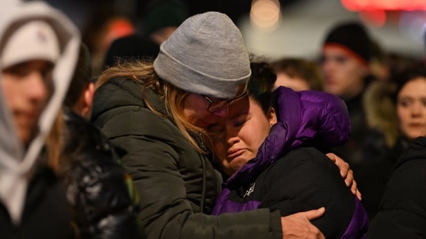 CRANS-MONTANA, SWITZERLAND - JANUARY 01: Mourners gather to leave flowers and candles at the scene after a fire broke out overnight at Le Constellation bar on January 01, 2026 in Crans-Montana, Switzerland. According to authorities, the fire began around 1:30 AM local time, with reports that 47 peop