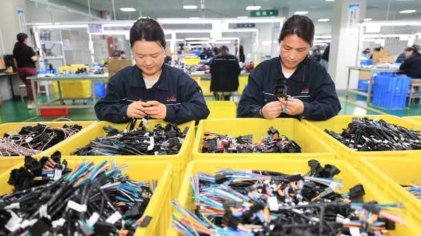 LIANYUNGANG, CHINA - MAY 13: Employees work to fulfill export orders at an electronics factory on May 13, 2025 in Lianyungang, Jiangsu Province of China. (Photo by VCG/VCG via Getty Images)