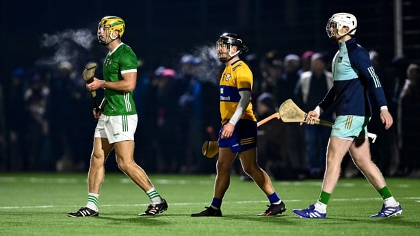 Limerick players Dan Morrissey, left, and goalkeeper Jamie Power with Clare's David Reidy, centre, during the 2024 Munster League clash