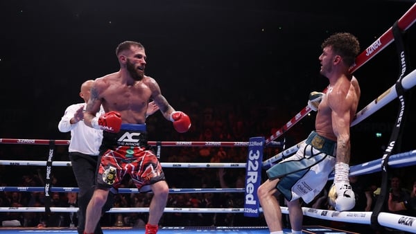 NOTTINGHAM, ENGLAND - MAY 10: Anthony Cacace knocks Leigh Wood onto the ropes during their IBO World Super Featherweight title fight at Motorpoint Arena Nottingham on May 10, 2025 in Nottingham, England. (Photo by Alex Livesey/Getty Images)