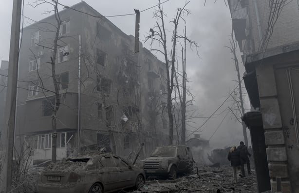 The aftermath of a Russian missile strike on a residential area of Kharkiv which left dust and debris on the street.