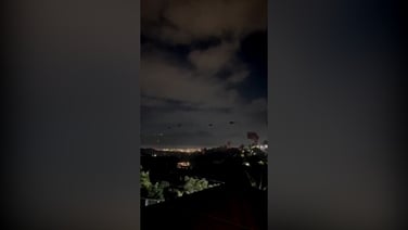 Helicopters fly over Venezuelan capital as explosions rock city