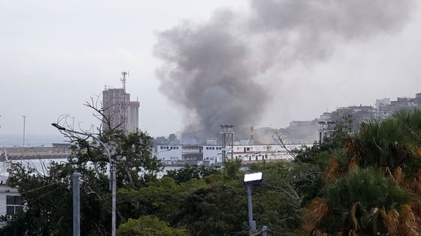 Smoke rises from the Port of La Guaira