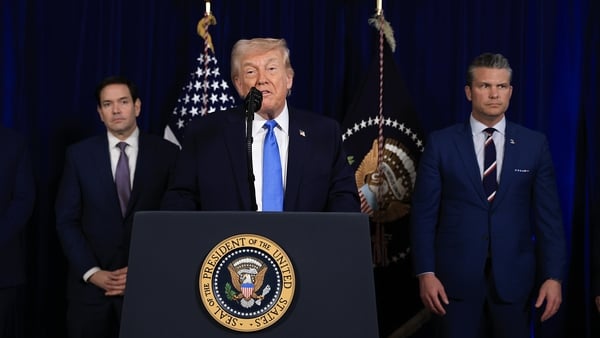 Donald Trump addresses the media alongside Marco Rubio (L) and Pete Hegseth