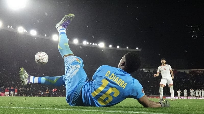 Mali goalkeeper Djigui Diarra denies Tunisia's Mohamed Ali Ben Romdhane in the penalty shoot-out