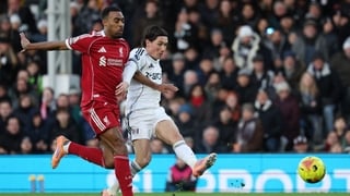 Harry Wilson (R) scores the opening goal to take the lead 1-0 during the English Premier League football match between Fulham and Liverpool at Craven Cottage in London on January 4, 2026.
