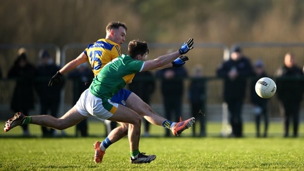 4 January 2026; Jack Tumulty of Roscommon shoots to score despite the efforts of Seán Harkin of Leitrim during the FBD Connacht League Round 1 match between Roscommon and Leitrim at at the Connacht GAA Centre of Excellence in Bekan, Mayo. Photo by Shauna Clinton/Sportsfile