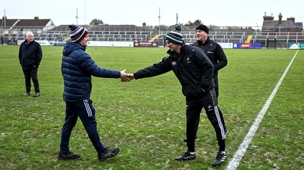 4 January 2026; Galway manager Micheál Donoghue, left, and Kildare manager Brian Dowling shake hands, watched by referee Owen Beehan after abandoning the Dioralyte Walsh Cup First Round match between Kildare and Galway at Cedral St Conleth's Park in Newbridge, Kildare. Photo by Sam Barnes/Sportsfile