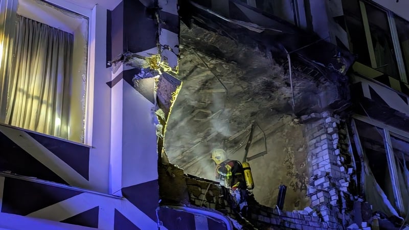 Rescue workers operate at the site of a Russian drone strike on a private hospital