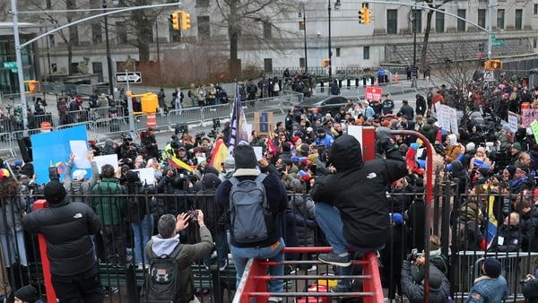 NEW YORK, NEW YORK - JANUARY 05: People gather outside of the Daniel Patrick Moynihan United States Courthouse before the arraignment of President of Venezuela Nicolas Maduro's and first lady Cilia Flores on January 05, 2026 in New York City. Maduro and f