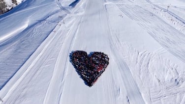 Skiers form heart-shaped tribute in memory of victims of deadly Swiss fire