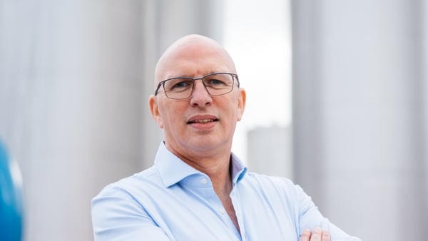 a man in shirt and glasses