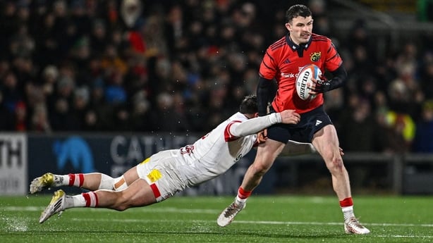 2 January 2026; Calvin Nash of Munster is tackled by James Hume of Ulster during the United Rugby Championship match between Ulster and Munster at Affidea Stadium in Belfast. Photo by Ramsey Cardy/Sportsfile