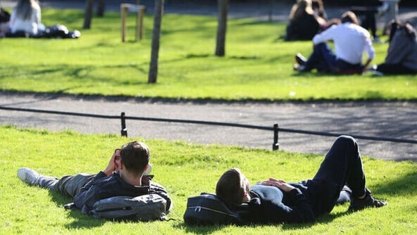 People enjoy the warm weather in St Stephen's Green in Dublin