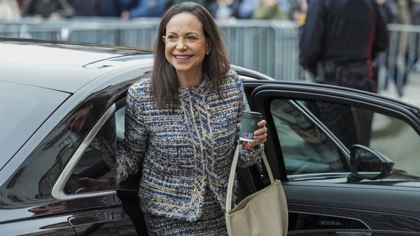 Maria Corina Machado gets out of a car in front of the Grand Hotel in Oslo