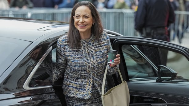 Maria Corina Machado gets out of a car in front of the Grand Hotel in Oslo 