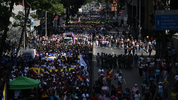 People gather⁣ in the streets in protest